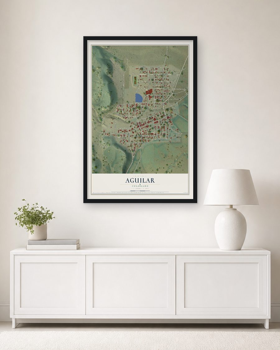 The Aguilar, Colorado map, 24 x 36 in, in a black wood frame on a living room wall