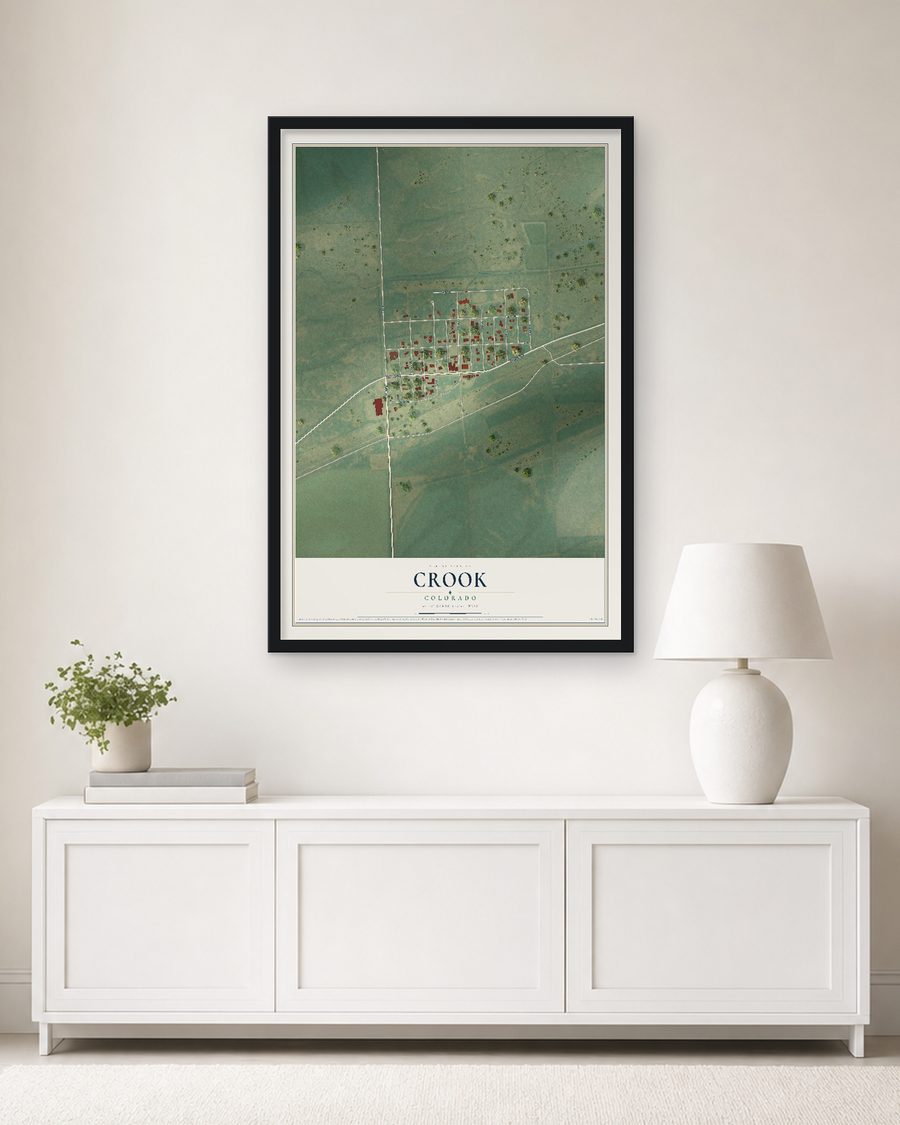 The Crook, Colorado map, 24 x 36 in, in a black wood frame on a living room wall