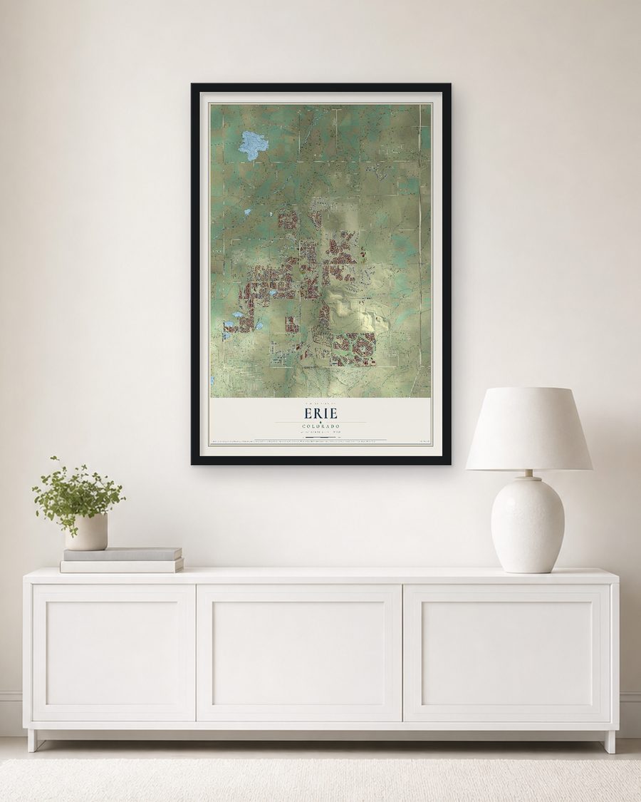 The Erie, Colorado map, 24 x 36 in, in a black wood frame on a living room wall