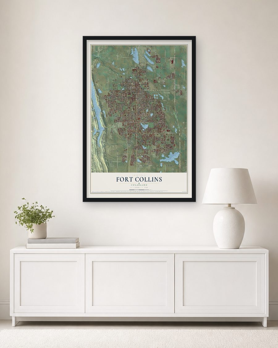 The Fort Collins, Colorado map, 24 x 36 in, in a black wood frame on a living room wall