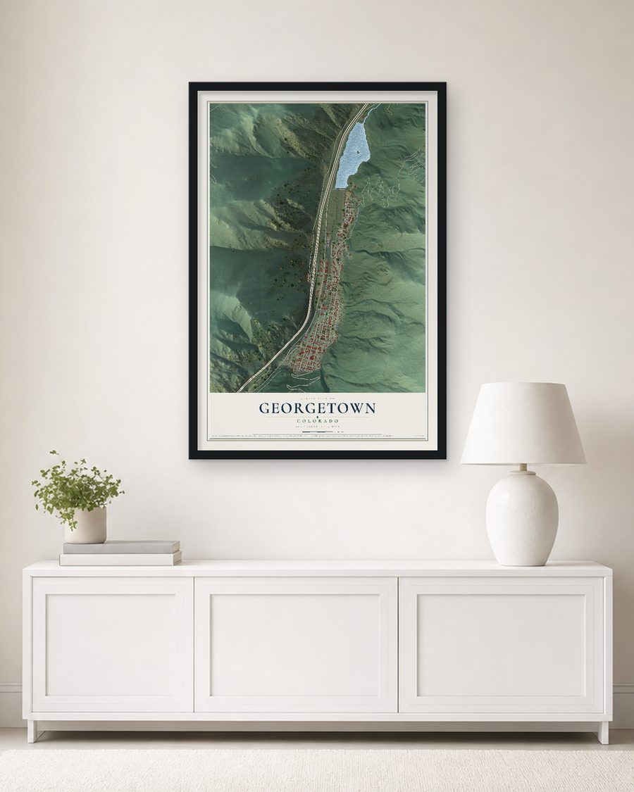 The Georgetown, Colorado map, 24 x 36 in, in a black wood frame on a living room wall