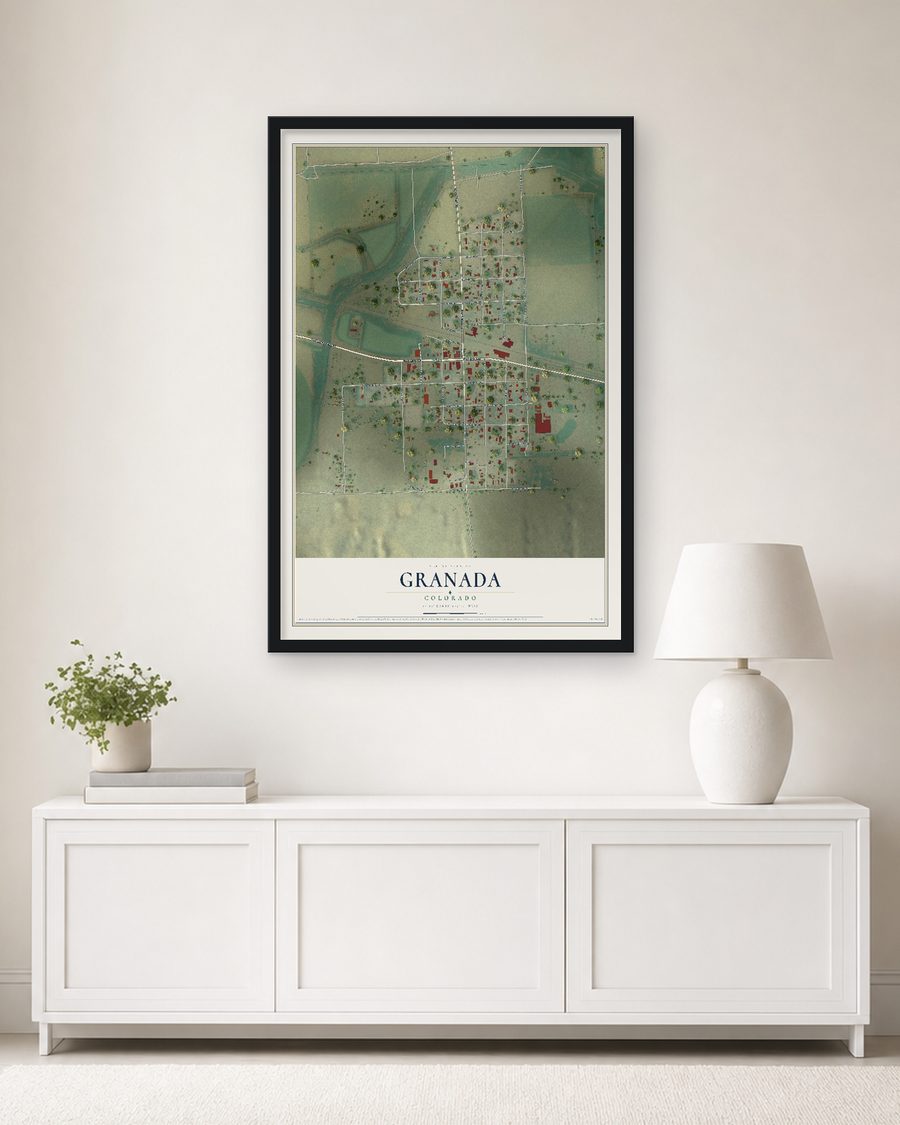 The Granada, Colorado map, 24 x 36 in, in a black wood frame on a living room wall
