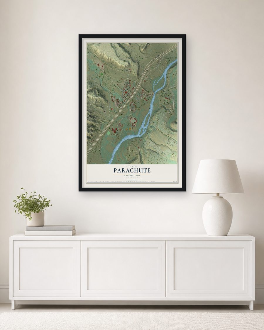 The Parachute, Colorado map, 24 x 36 in, in a black wood frame on a living room wall