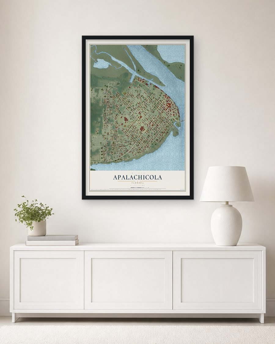 The Apalachicola, Florida map, 24 x 36 in, in a black wood frame on a living room wall