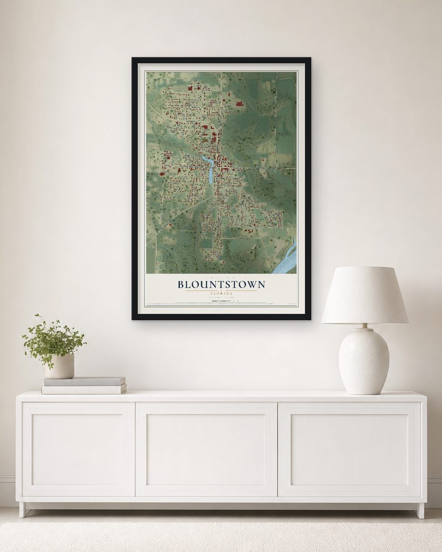 The Blountstown, Florida map, 24 x 36 in, in a black wood frame on a living room wall