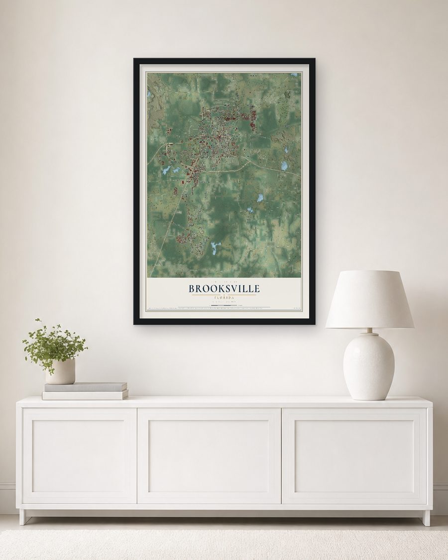 The Brooksville, Florida map, 24 x 36 in, in a black wood frame on a living room wall