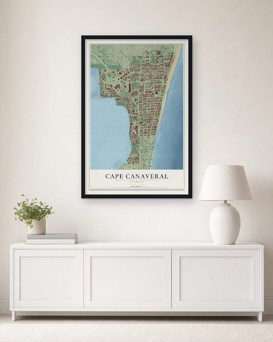 The Cape Canaveral, Florida map, 24 x 36 in, in a black wood frame on a living room wall