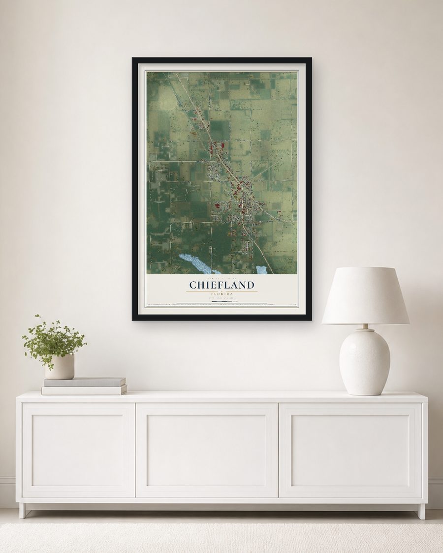 The Chiefland, Florida map, 24 x 36 in, in a black wood frame on a living room wall