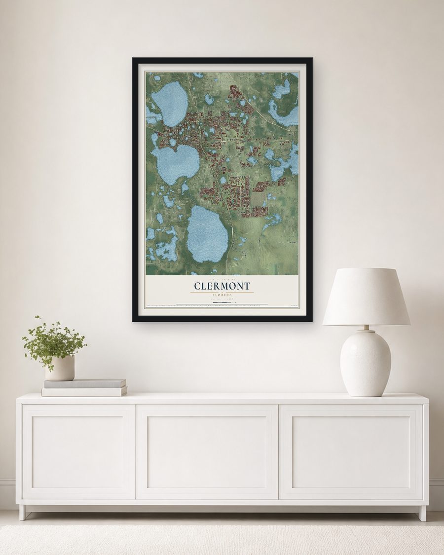 The Clermont, Florida map, 24 x 36 in, in a black wood frame on a living room wall