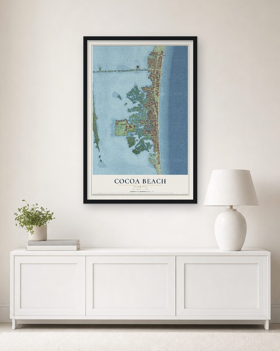 The Cocoa Beach, Florida map, 24 x 36 in, in a black wood frame on a living room wall