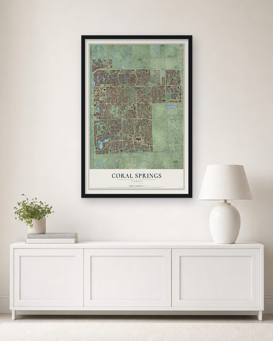 The Coral Springs, Florida map, 24 x 36 in, in a black wood frame on a living room wall