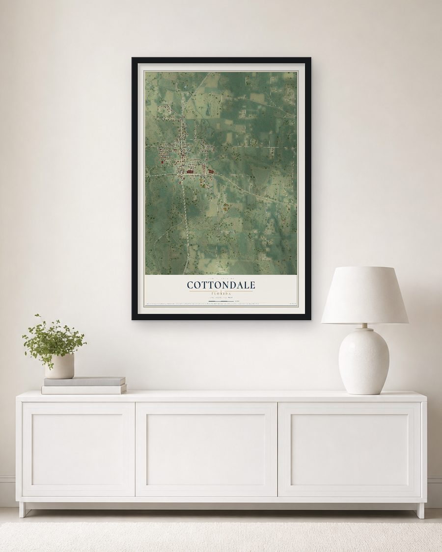 The Cottondale, Florida map, 24 x 36 in, in a black wood frame on a living room wall