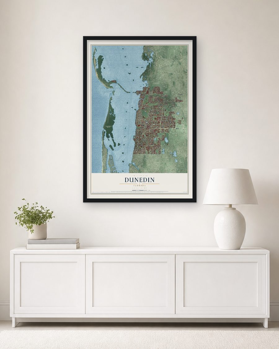 The Dunedin, Florida map, 24 x 36 in, in a black wood frame on a living room wall