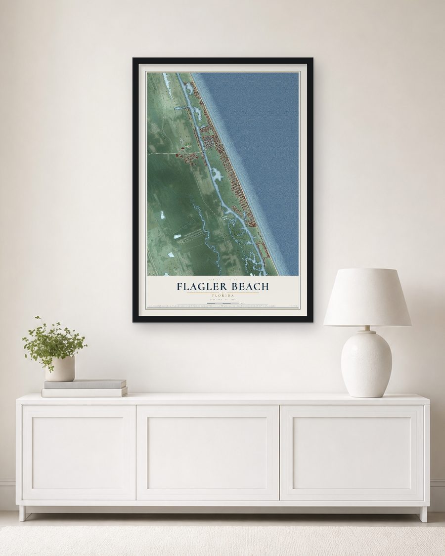 The Flagler Beach, Florida map, 24 x 36 in, in a black wood frame on a living room wall