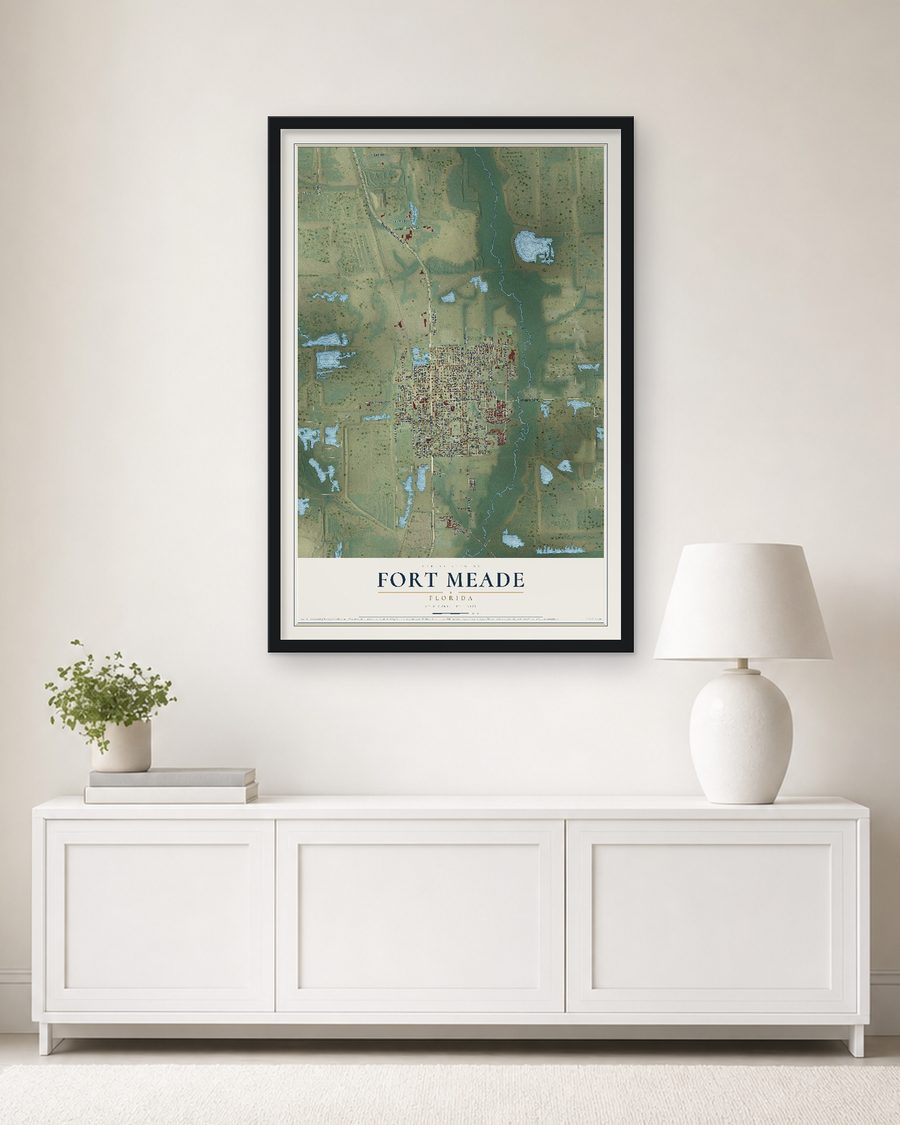 The Fort Meade, Florida map, 24 x 36 in, in a black wood frame on a living room wall