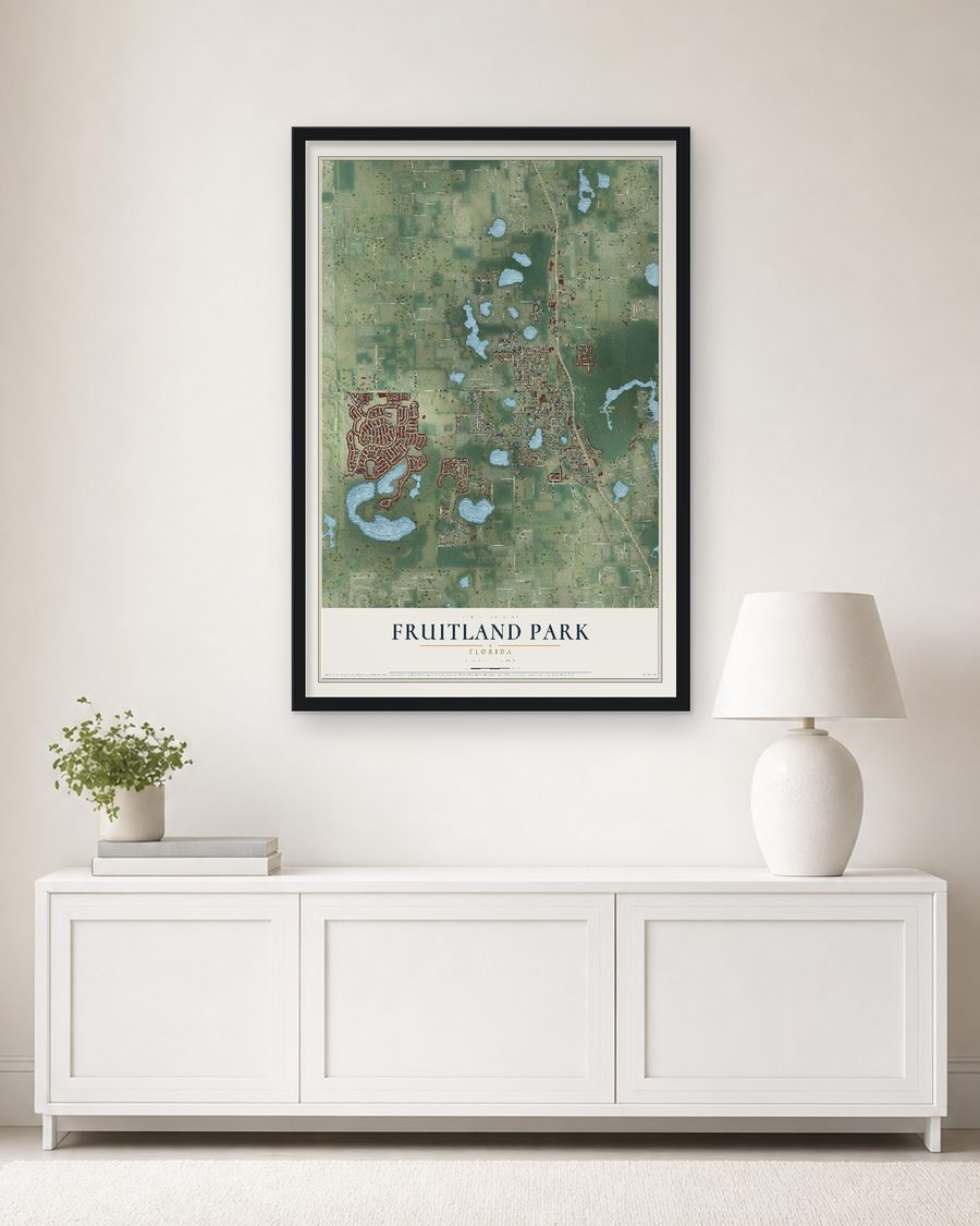 The Fruitland Park, Florida map, 24 x 36 in, in a black wood frame on a living room wall