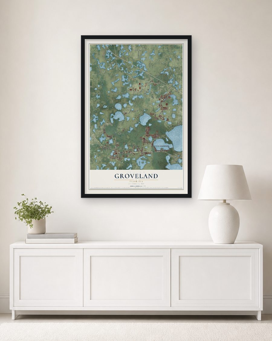 The Groveland, Florida map, 24 x 36 in, in a black wood frame on a living room wall