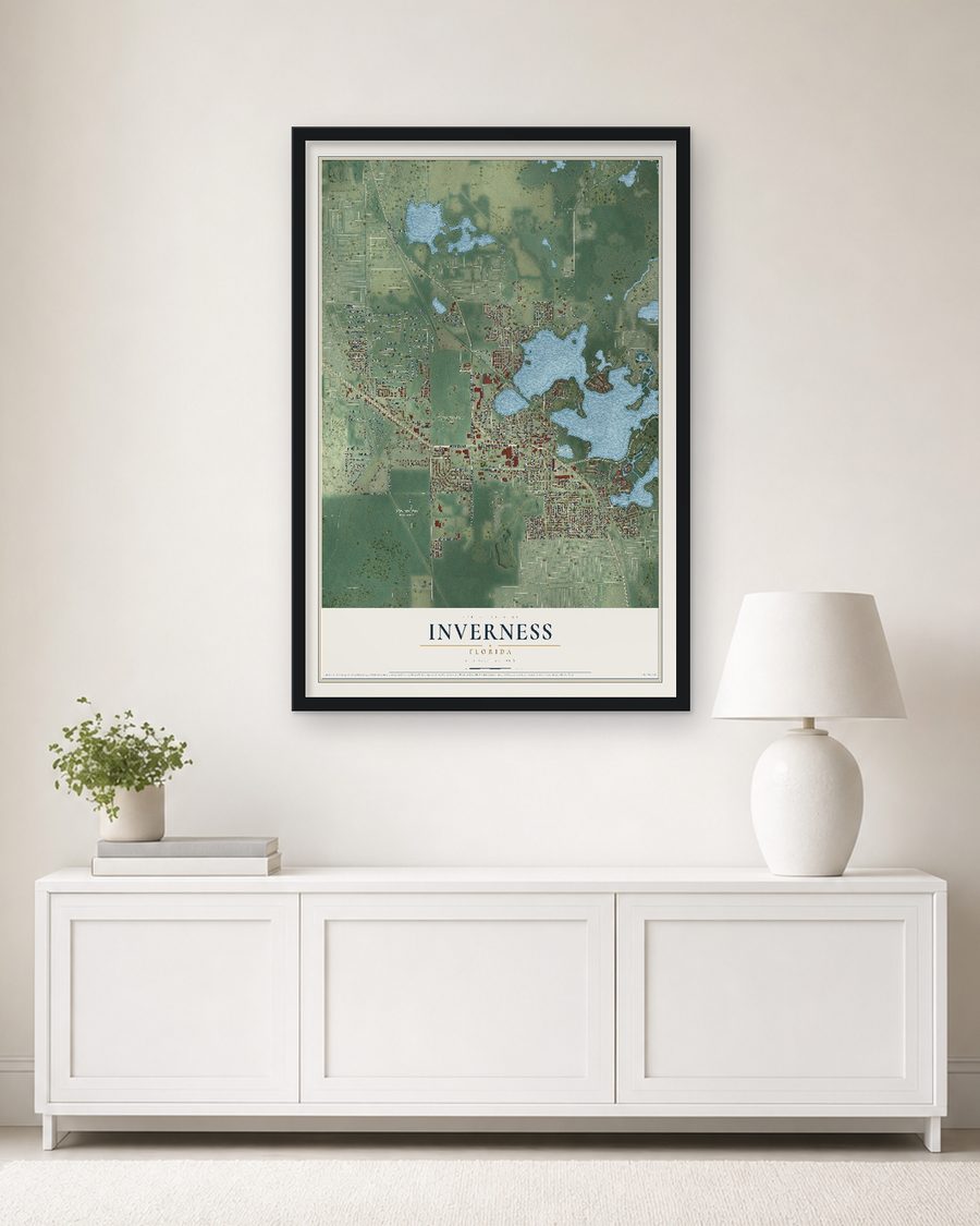 The Inverness, Florida map, 24 x 36 in, in a black wood frame on a living room wall