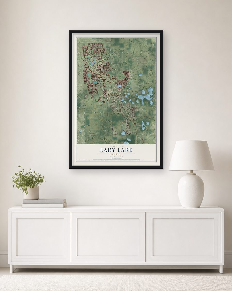 The Lady Lake, Florida map, 24 x 36 in, in a black wood frame on a living room wall