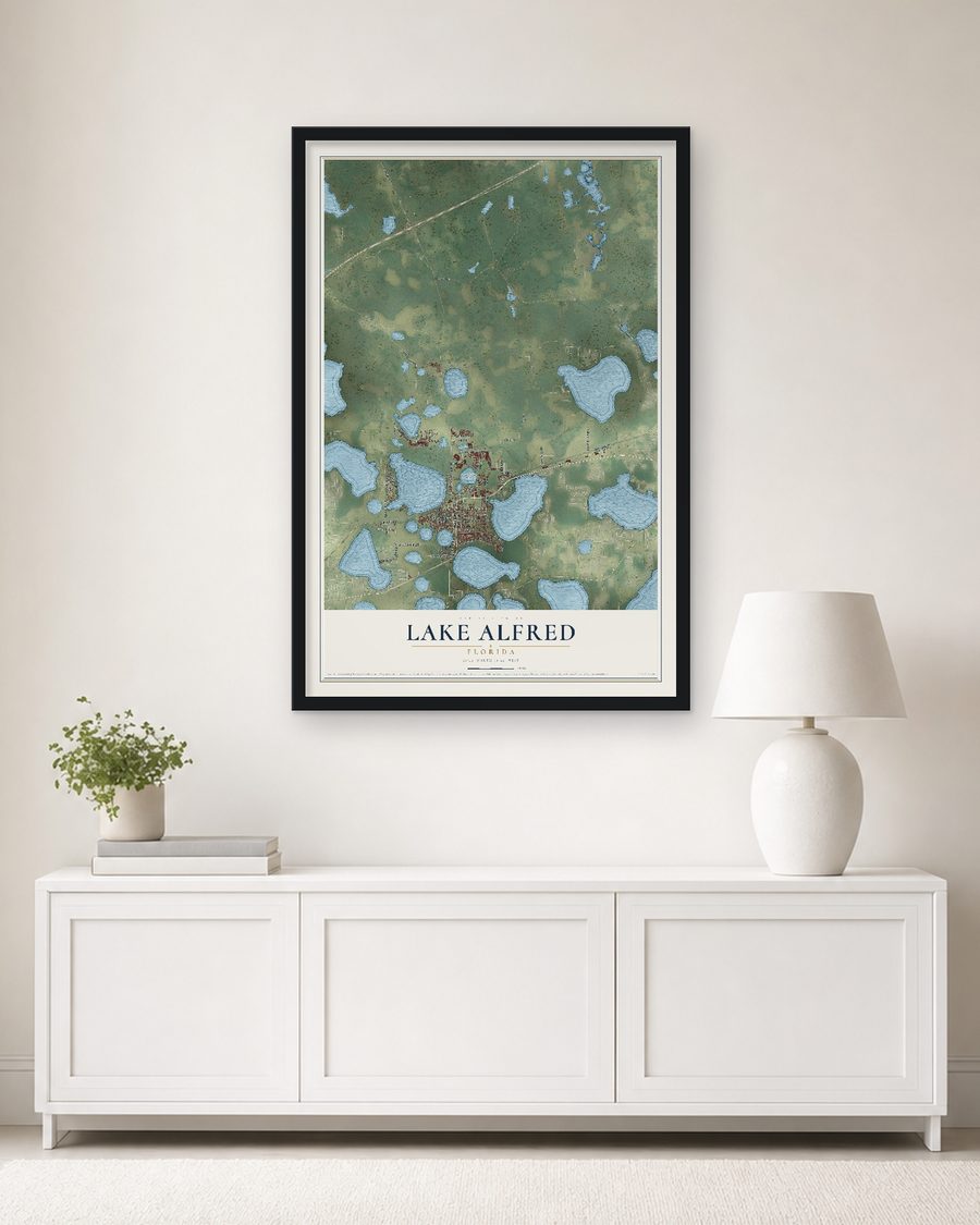 The Lake Alfred, Florida map, 24 x 36 in, in a black wood frame on a living room wall