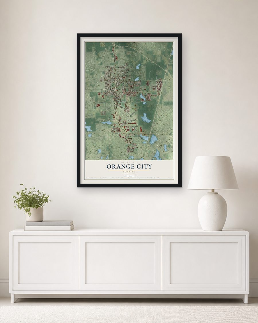 The Orange City, Florida map, 24 x 36 in, in a black wood frame on a living room wall