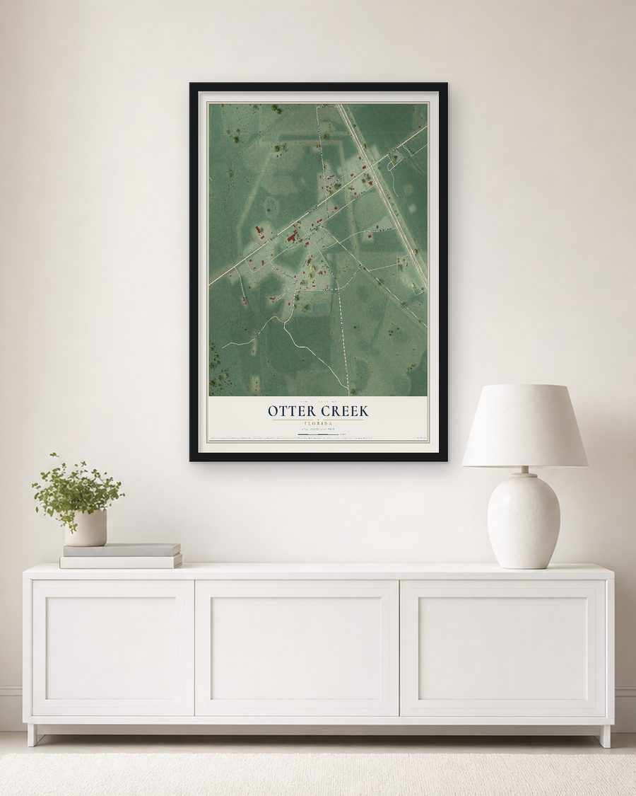 The Otter Creek, Florida map, 24 x 36 in, in a black wood frame on a living room wall