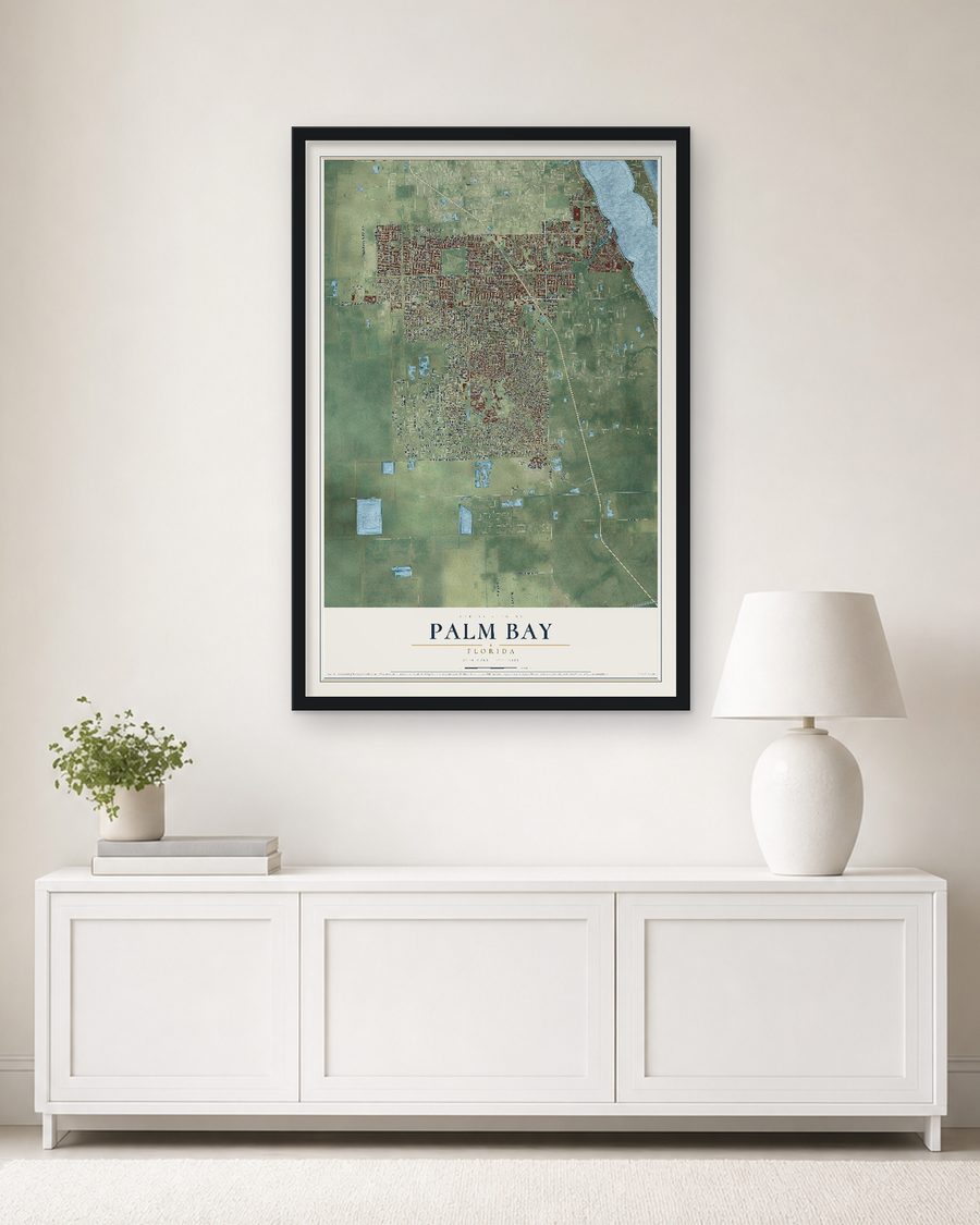The Palm Bay, Florida map, 24 x 36 in, in a black wood frame on a living room wall