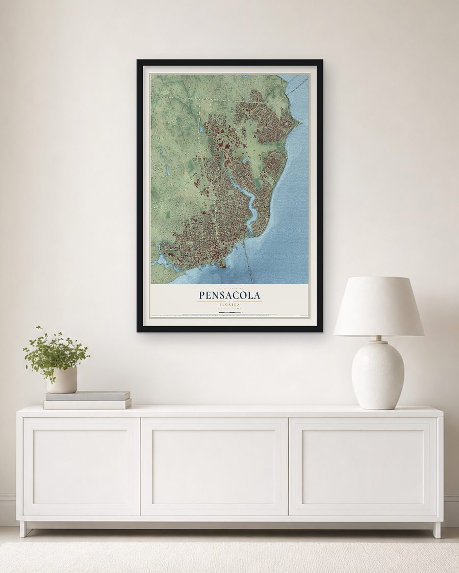 The Pensacola, Florida map, 24 x 36 in, in a black wood frame on a living room wall