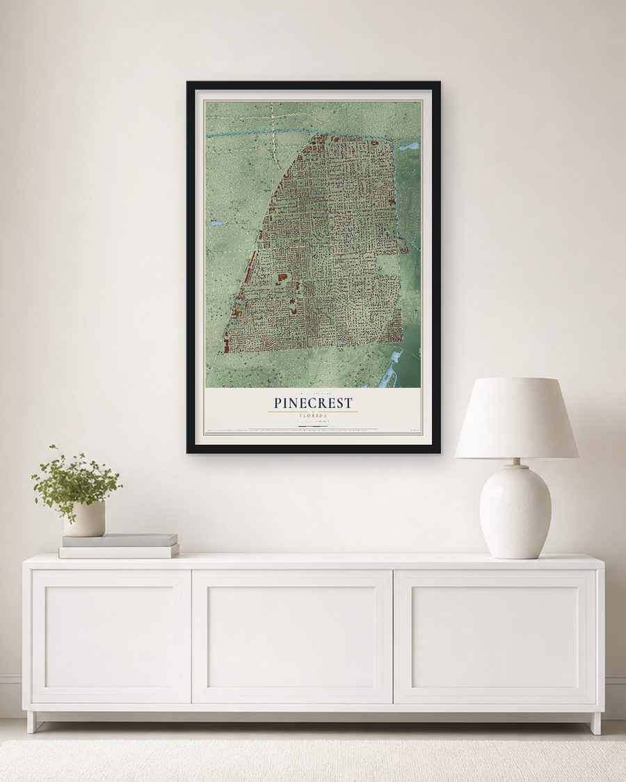 The Pinecrest, Florida map, 24 x 36 in, in a black wood frame on a living room wall