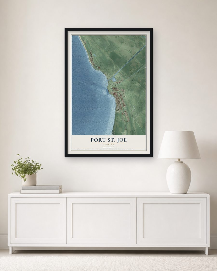 The Port St. Joe, Florida map, 24 x 36 in, in a black wood frame on a living room wall