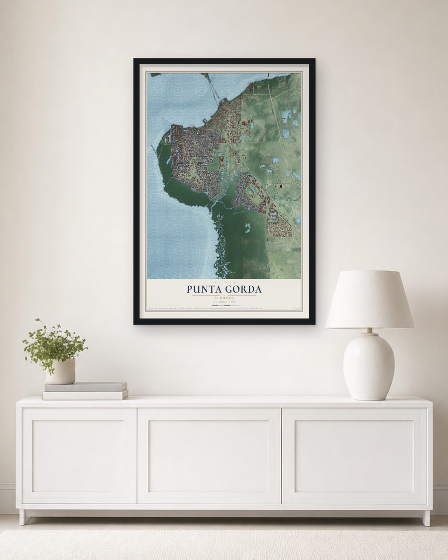 The Punta Gorda, Florida map, 24 x 36 in, in a black wood frame on a living room wall