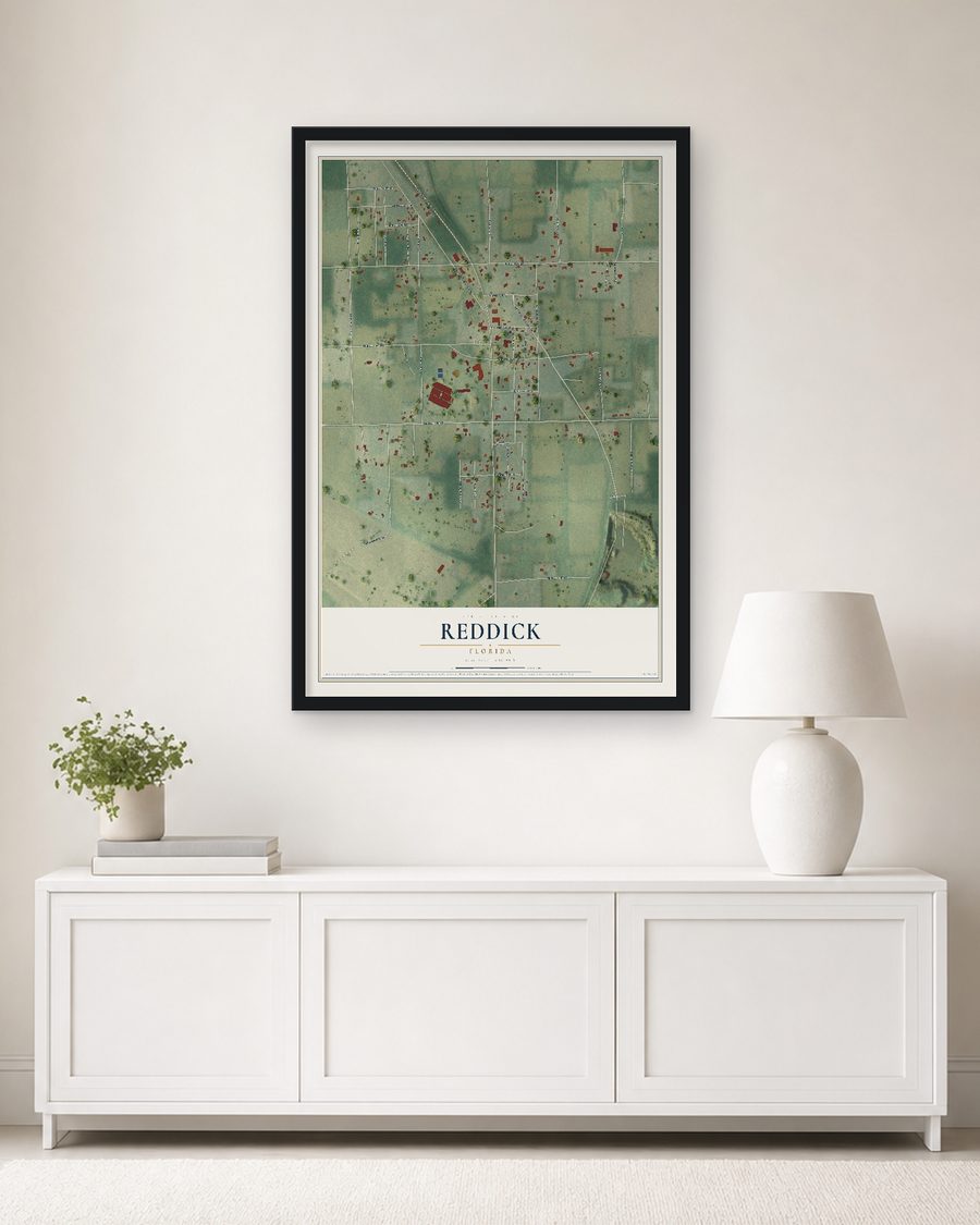 The Reddick, Florida map, 24 x 36 in, in a black wood frame on a living room wall