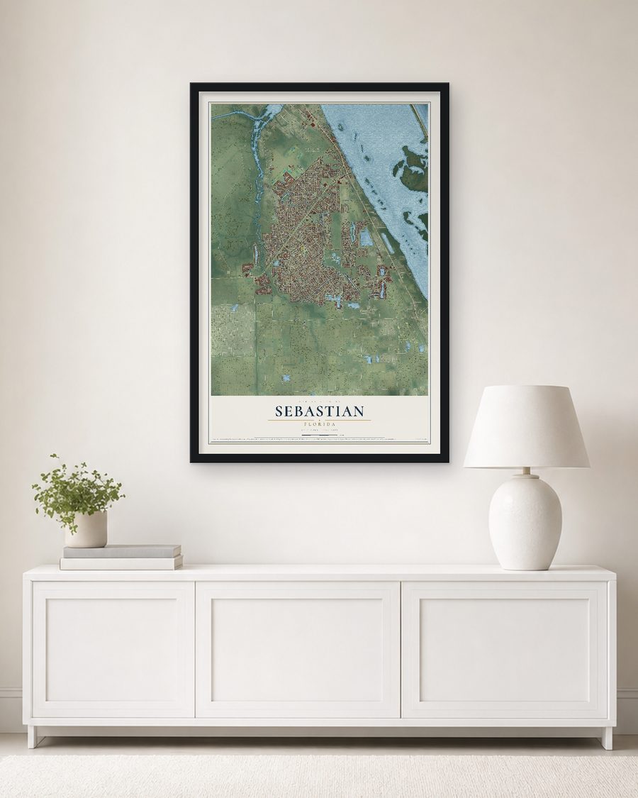 The Sebastian, Florida map, 24 x 36 in, in a black wood frame on a living room wall