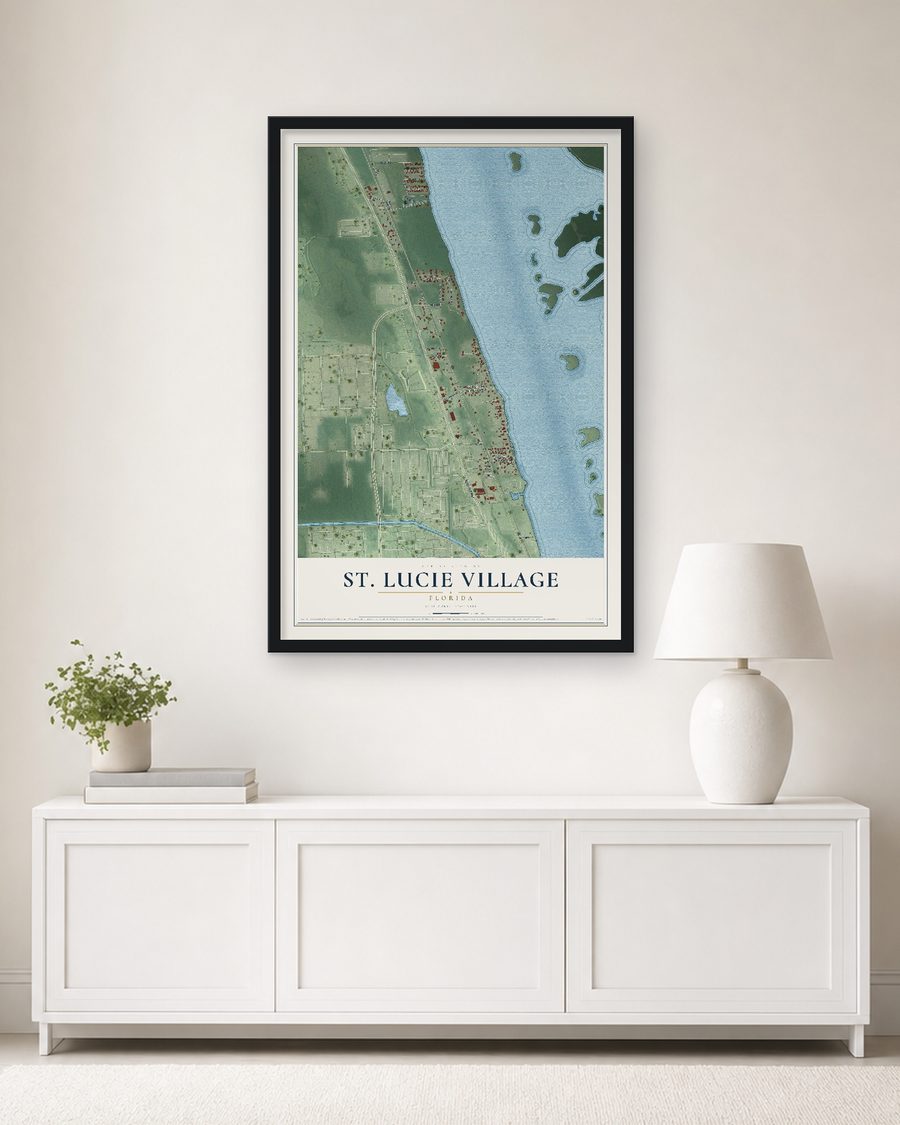 The St. Lucie Village, Florida map, 24 x 36 in, in a black wood frame on a living room wall