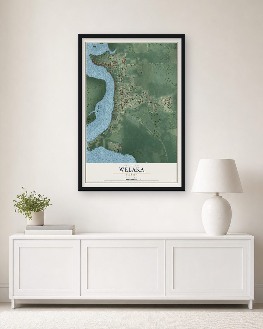 The Welaka, Florida map, 24 x 36 in, in a black wood frame on a living room wall