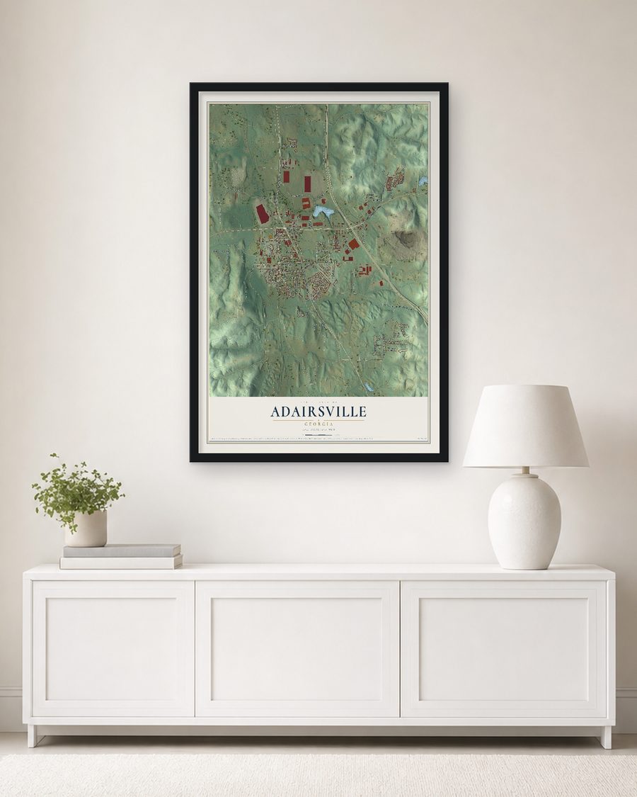 The Adairsville, Georgia map, 24 x 36 in, in a black wood frame on a living room wall