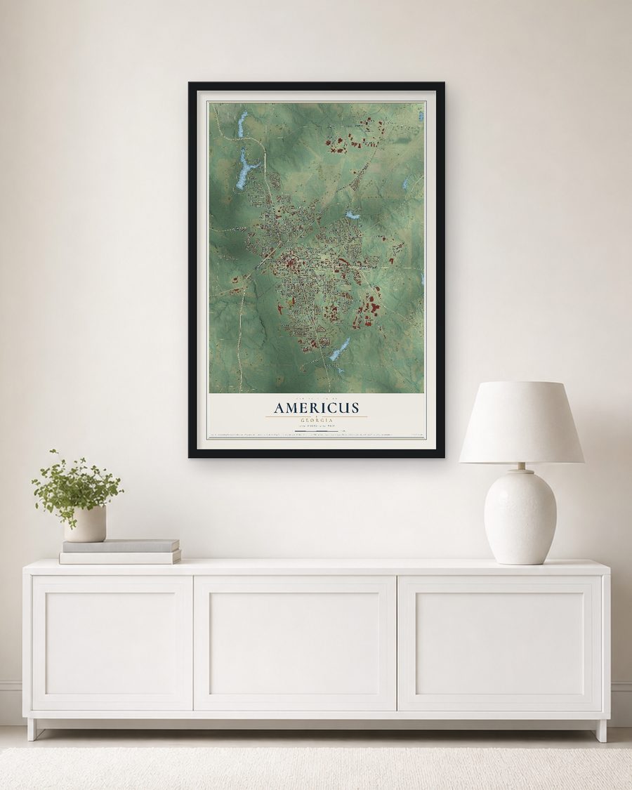 The Americus, Georgia map, 24 x 36 in, in a black wood frame on a living room wall