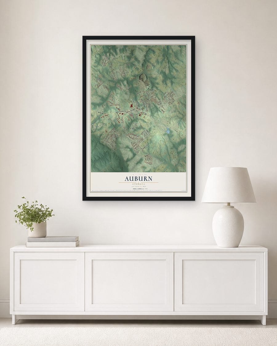 The Auburn, Georgia map, 24 x 36 in, in a black wood frame on a living room wall