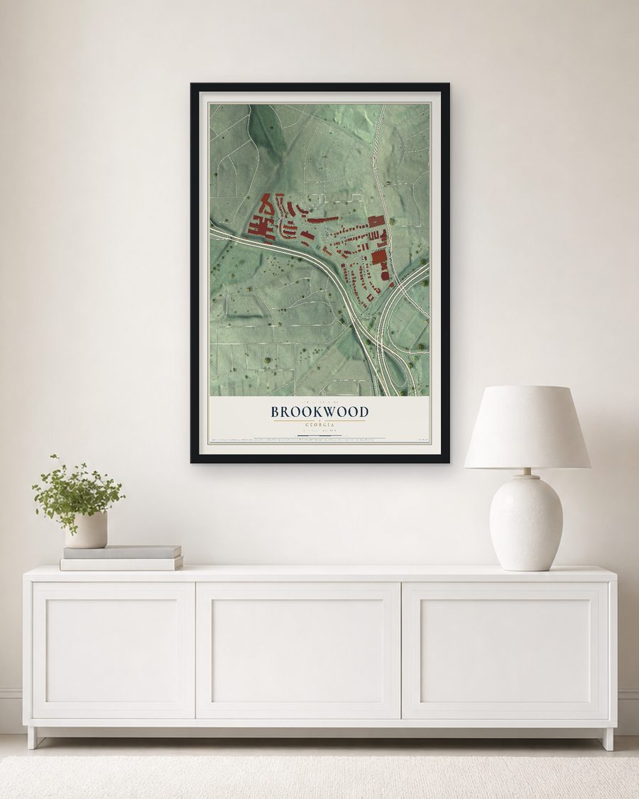 The Brookwood, Georgia map, 24 x 36 in, in a black wood frame on a living room wall