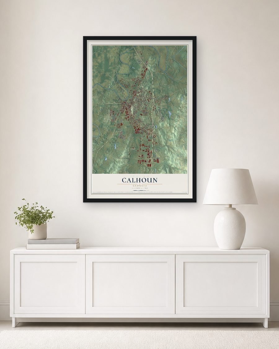 The Calhoun, Georgia map, 24 x 36 in, in a black wood frame on a living room wall