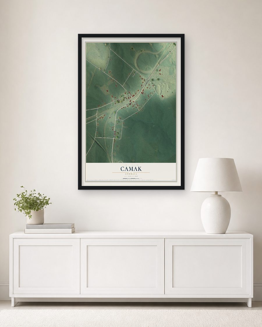 The Camak, Georgia map, 24 x 36 in, in a black wood frame on a living room wall
