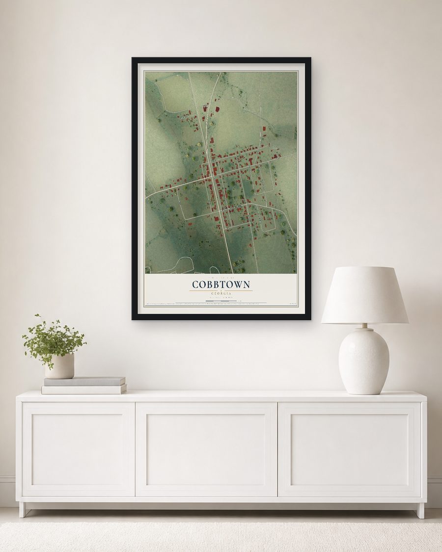 The Cobbtown, Georgia map, 24 x 36 in, in a black wood frame on a living room wall