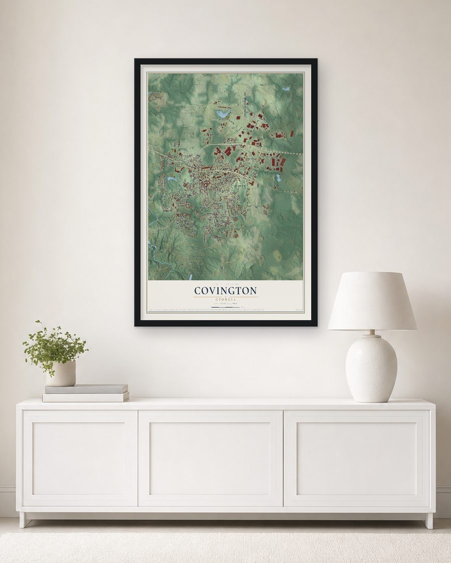 The Covington, Georgia map, 24 x 36 in, in a black wood frame on a living room wall
