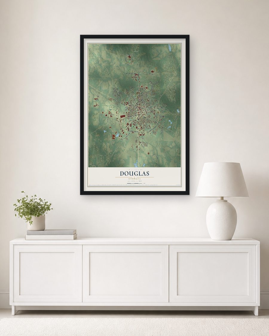 The Douglas, Georgia map, 24 x 36 in, in a black wood frame on a living room wall