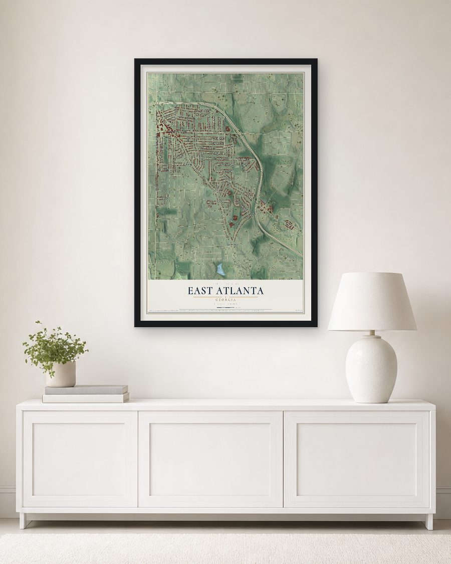 The East Atlanta, Georgia map, 24 x 36 in, in a black wood frame on a living room wall