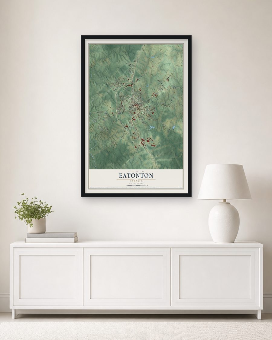 The Eatonton, Georgia map, 24 x 36 in, in a black wood frame on a living room wall