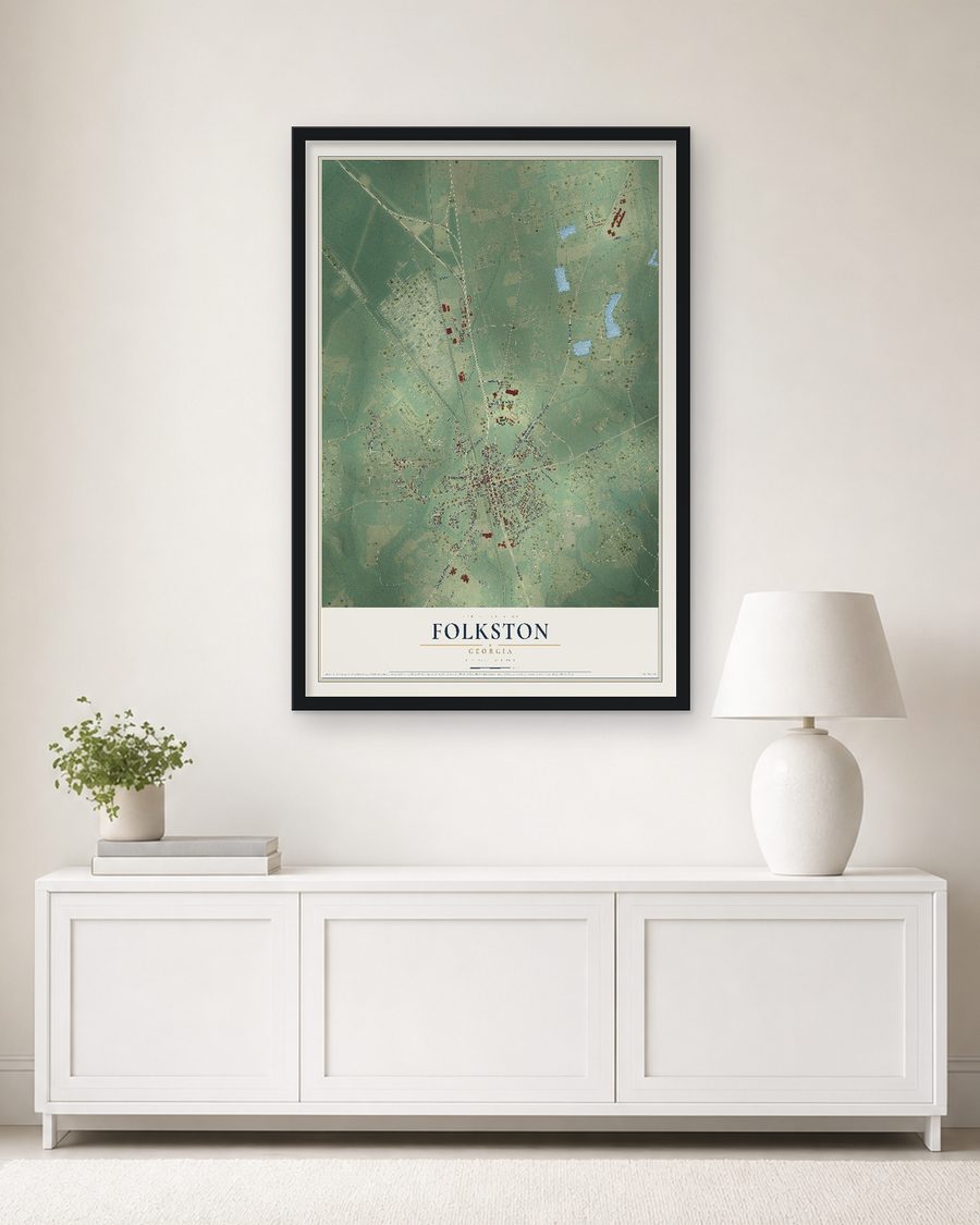 The Folkston, Georgia map, 24 x 36 in, in a black wood frame on a living room wall