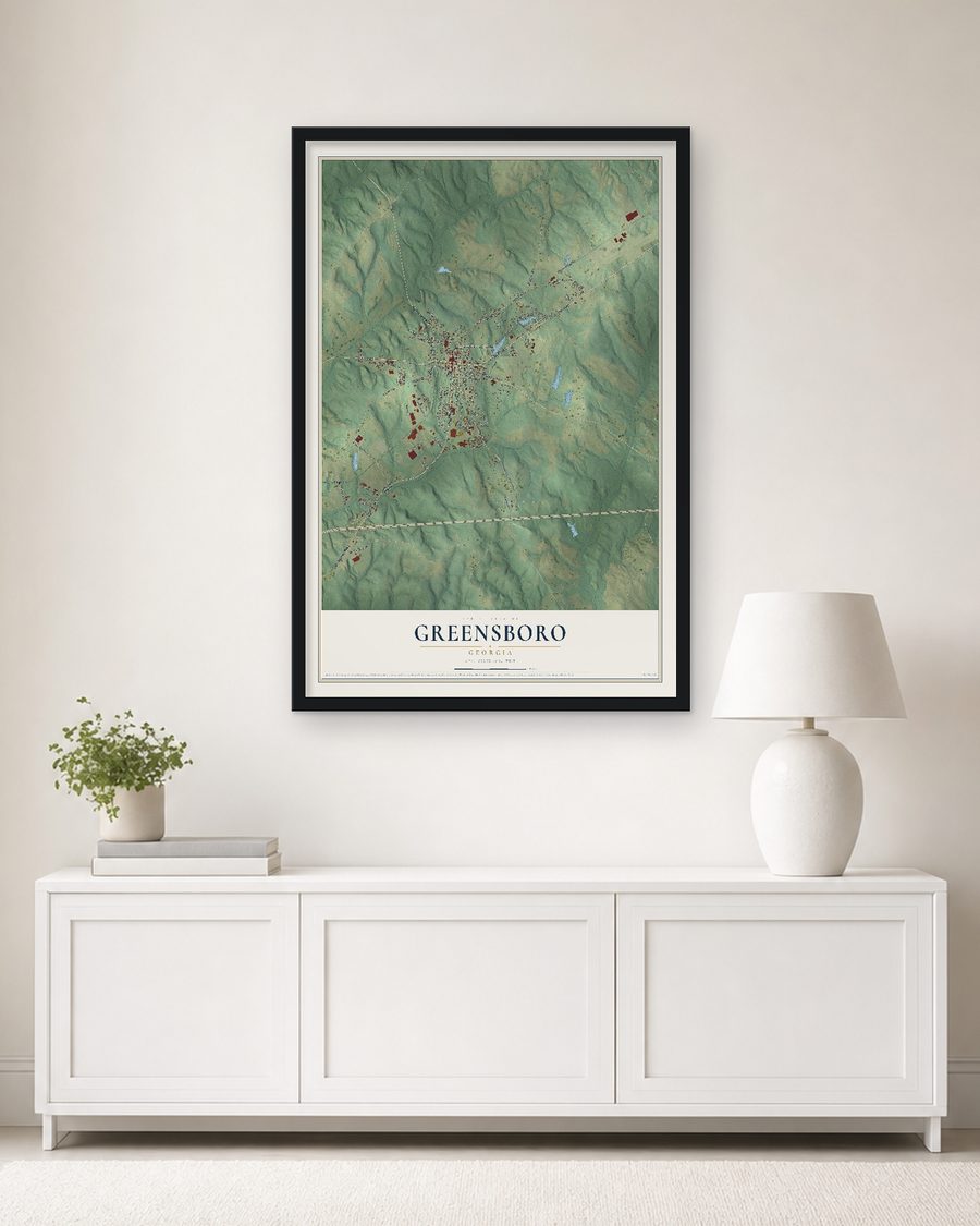 The Greensboro, Georgia map, 24 x 36 in, in a black wood frame on a living room wall
