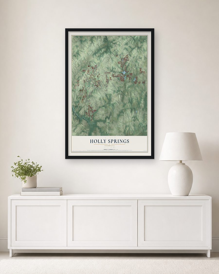 The Holly Springs, Georgia map, 24 x 36 in, in a black wood frame on a living room wall