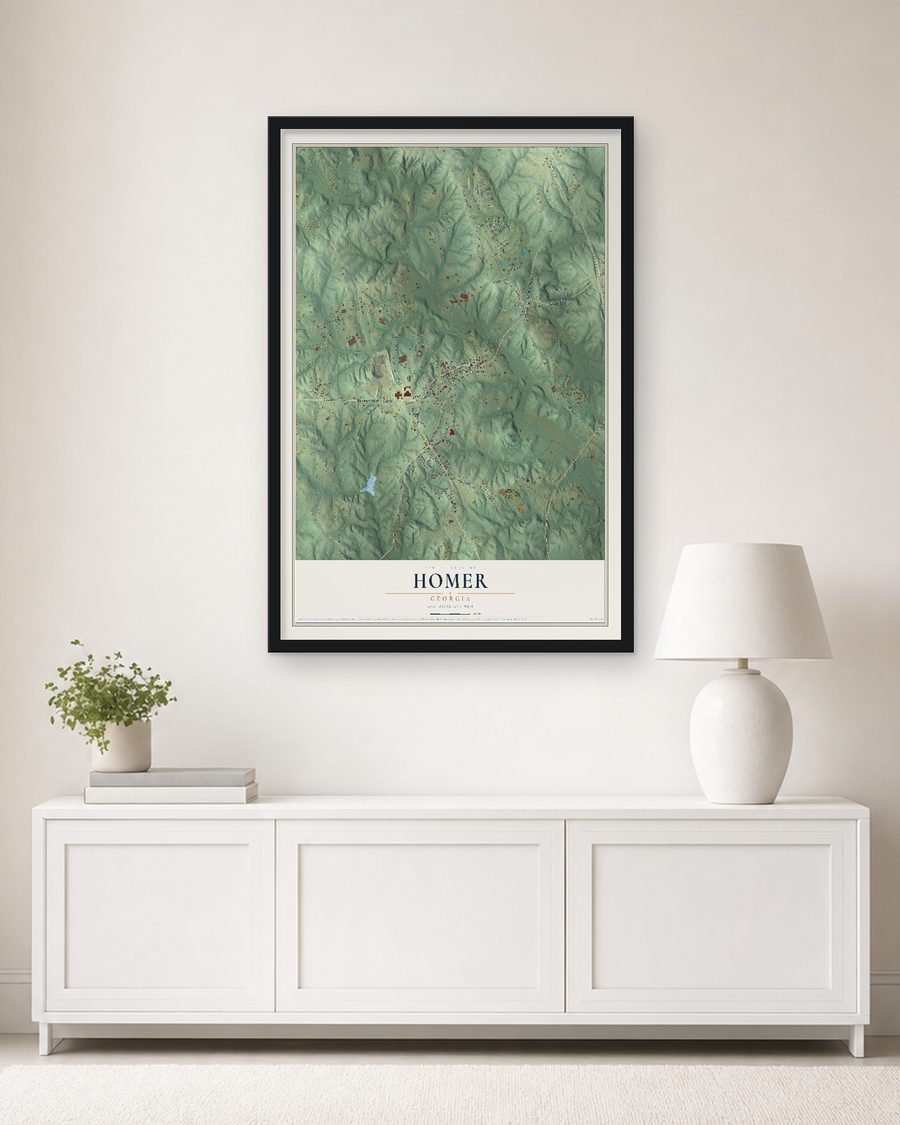 The Homer, Georgia map, 24 x 36 in, in a black wood frame on a living room wall